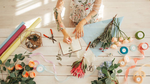 High angle view of woman painting on table