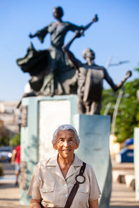 Senior woman traveling at the ronda del sinu linear park of monteria in colombia.