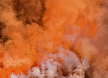 Full frame shot of orange smoke