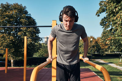 Young man exercising at park