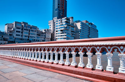 Exterior of buildings against clear blue sky