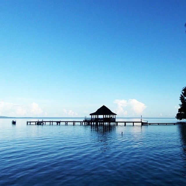 water, blue, waterfront, pier, sea, tranquil scene, tranquility, built structure, scenics, architecture, copy space, rippled, clear sky, beauty in nature, sky, nature, idyllic, reflection, calm, connection