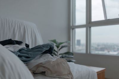 Woman sleeping on bed at home