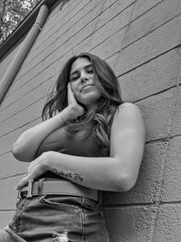 Portrait of a young woman sitting outdoors