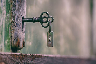 Close-up of padlock on metal door