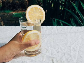 Close-up of hand holding drink