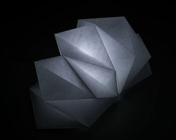 Close-up of abstract object over black background