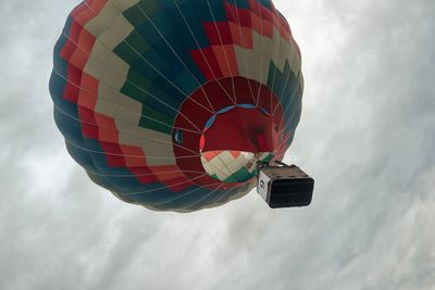 Low angle view of hot air balloons against sky