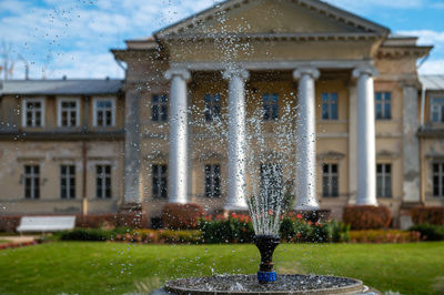 Krimulda manor or castle and garden with a fountain in the gauja national park near sigulda, latvia