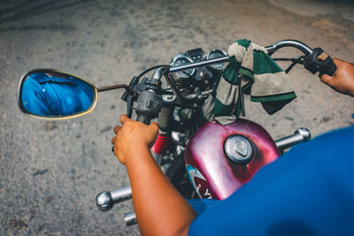 High angle view of man riding bicycle on street