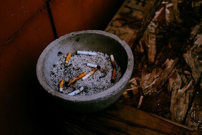 Close-up of cigarette on wood