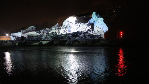 Illuminated water at night