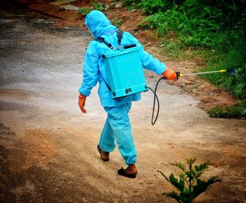 Full length of man working in water