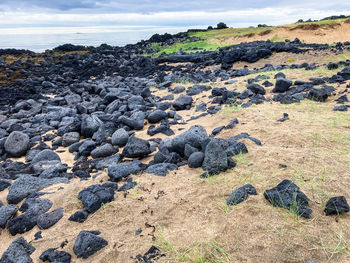 Scenic view of rocks on land against sky