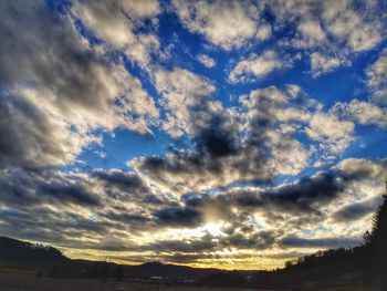 Low angle view of cloudy sky during sunset