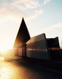 Built structure against sky at sunset