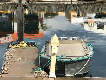 Boats moored in lake