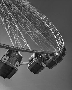 Low angle view of ferris wheel against sky