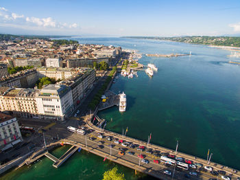 High angle view of buildings by sea against sky