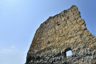 Low angle view of castle against clear blue sky