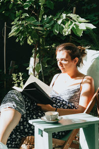 Young woman using laptop at home