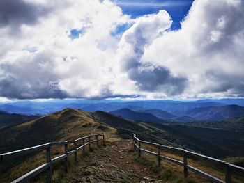Scenic view of landscape and mountains against sky