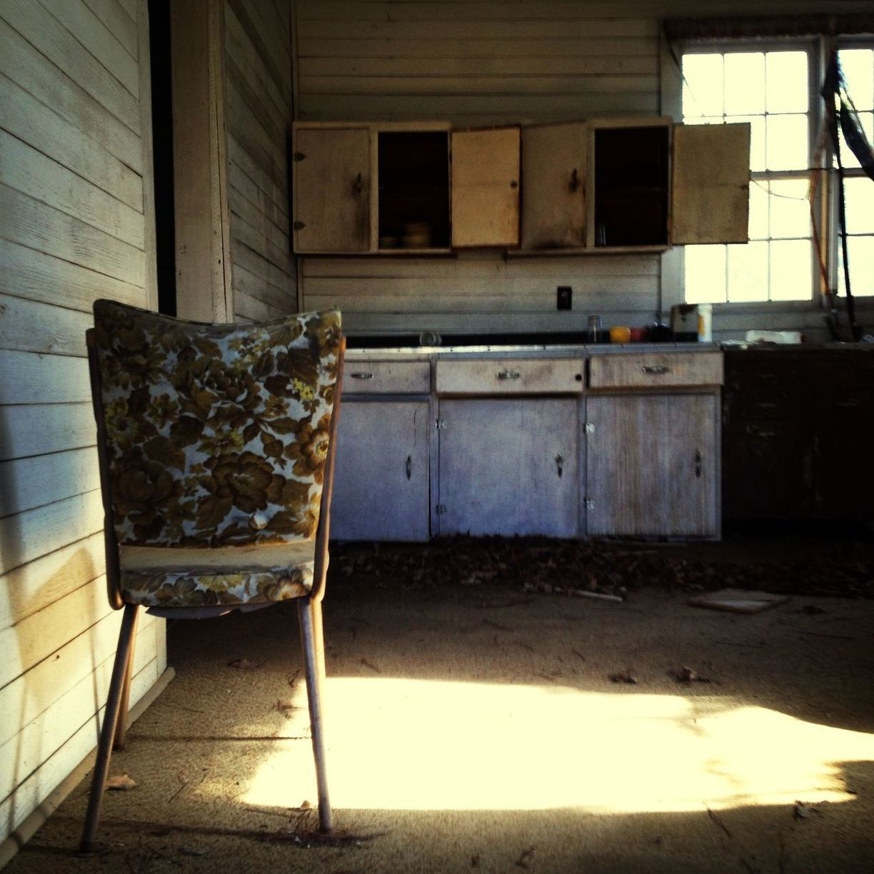 built structure, architecture, abandoned, absence, chair, indoors, empty, house, wood - material, obsolete, old, damaged, no people, run-down, furniture, sunlight, table, building exterior, day, bench