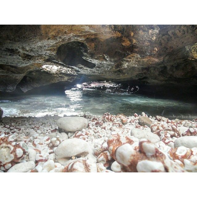 transfer print, auto post production filter, water, rock - object, beach, sea, rock, shore, rock formation, nature, stone - object, beauty in nature, pebble, tranquil scene, tranquility, scenics, stone, sand, outdoors, day