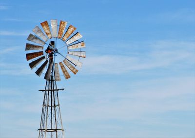 Low angle view of ferris wheel against sky