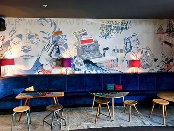 Empty chairs and tables in restaurant