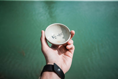 Close-up of hand holding ice cream