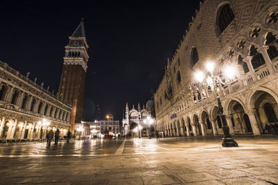 Illuminated buildings in city at night