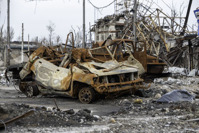 Abandoned car on field