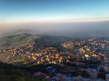 Aerial view of cityscape against sky