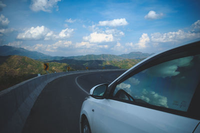 High angle view of road against cloudy sky