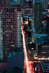 Illuminated buildings in city at night