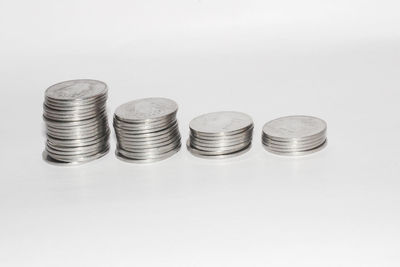 Stack of objects on table against white background