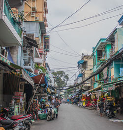 Street amidst buildings in city against sky