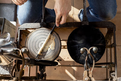 Close up of middle aged man hands cooking homemade artisan pastry