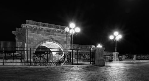 Illuminated street lights at night