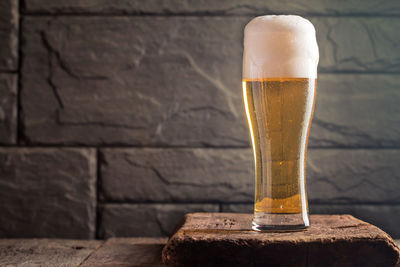 Close-up of beer glass on table