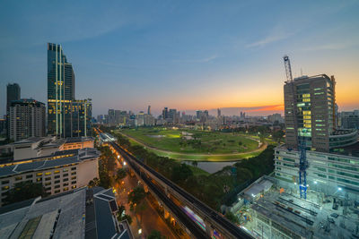 High angle view of buildings in city against sky