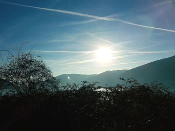 Scenic view of landscape against sky at sunset