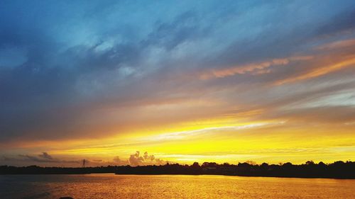 View of calm lake at sunset