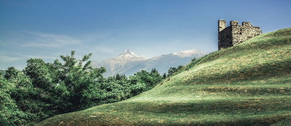 Panoramic view of trees and buildings against sky