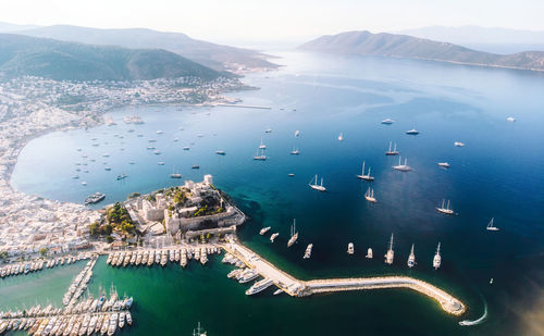 Saint peter castle and marina - bodrum, turkey. bodrum castle with sailing ship yachts in sea 