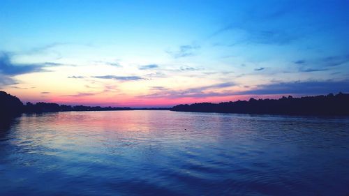 Scenic view of calm sea at sunset