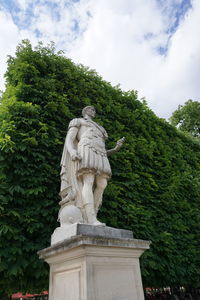 Low angle view of statue against sky