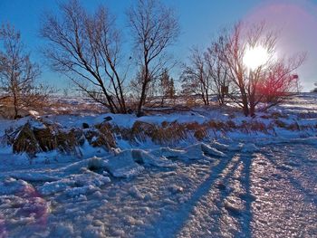 Scenic view of snow covered landscape against sky