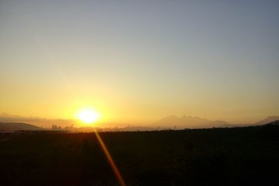 Scenic view of landscape against sky during sunset